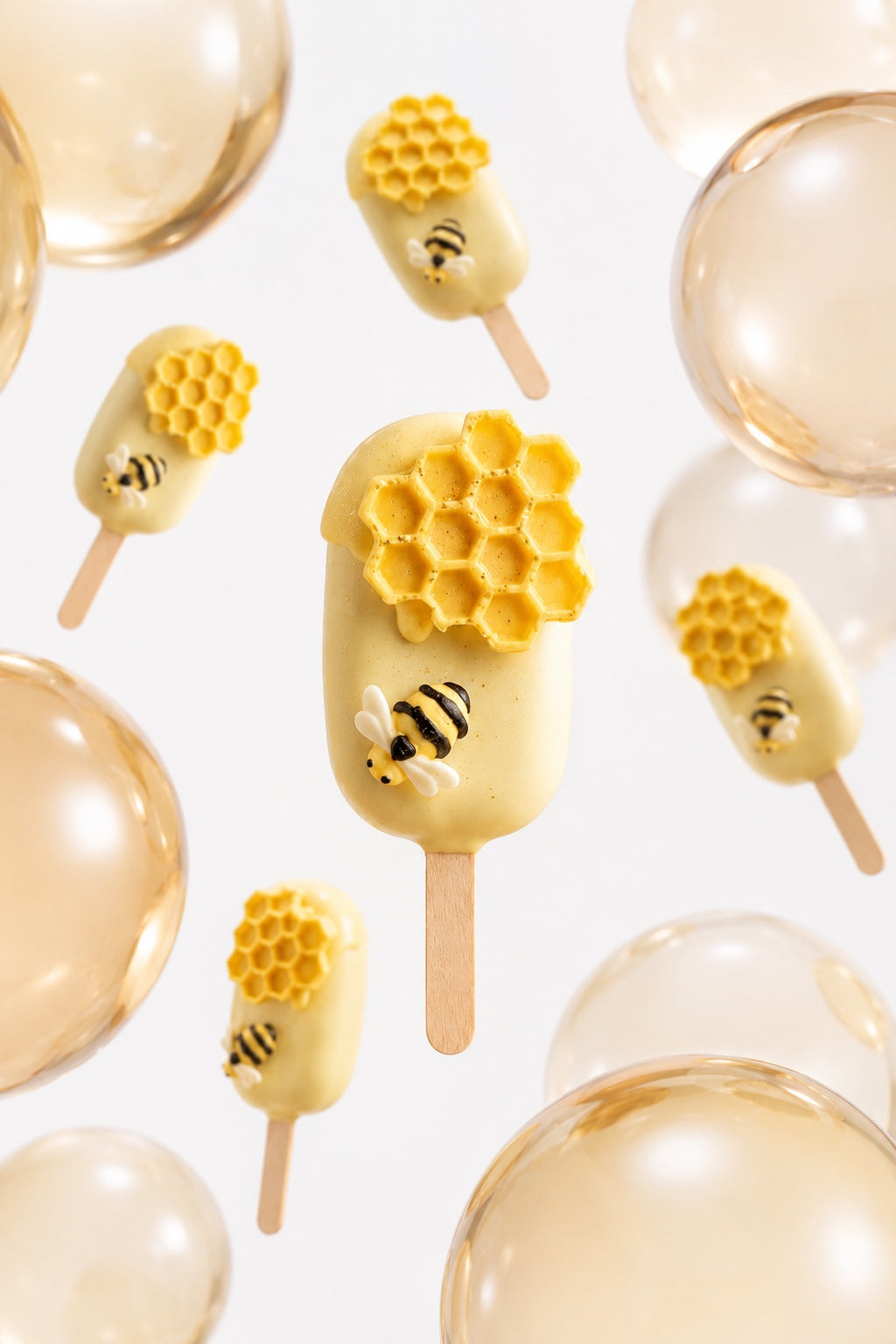 Yellow honeycomb and bumblebee cakesicle with coordinated dessert display